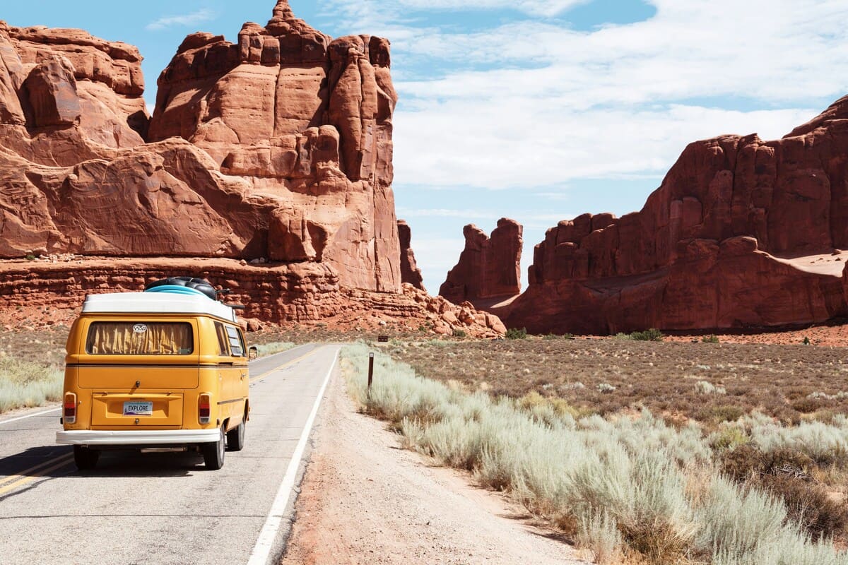 yellow volkswagen van on road